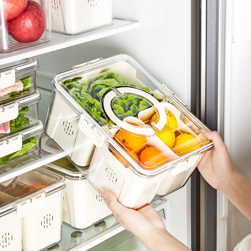Three-compartment fridge container holding sliced vegetables and eggs in a clear lid